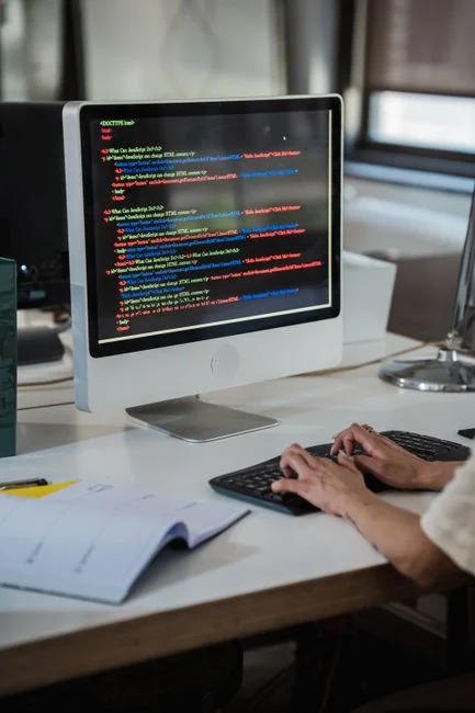 A woman wearing headphones hosts an online webinar from her home office.